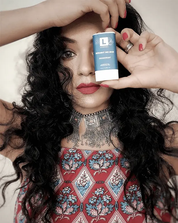 A Girl Holding Lineal Mini Deodorant